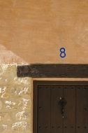 number 8 above the wooden door