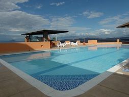 swiming pool on roof under blue sky