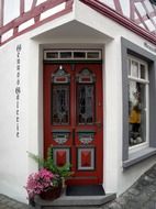 painted wooden entrance door of truss house