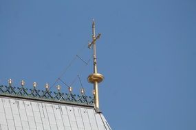 gold cross on the roof of the Church in Cologne