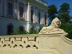 the figure of a lion on the railing