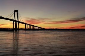 bridge against the bright evening sky