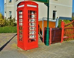 red telephone house on a street