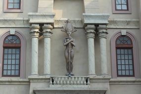 big statue with sword on cathedrals wall