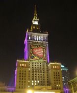 skyscraper in night lighting in Warsaw