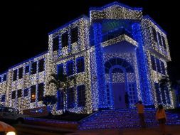 facade of the building is decorated with blue lights