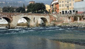 old stone bridge over the Adige river in Verona