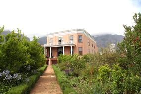 beautiful house with walkway in the garden