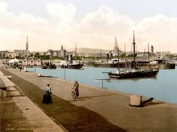 old photo of sailing ships in kingstown port at city, ireland, dublin