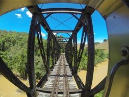 steel tracks bridge above river