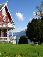 solitary house among the plants by the lake in Norway