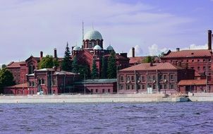 view from the water of the old town on a sunny day