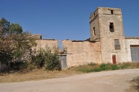 abandoned brick building at road