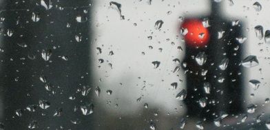 grey raindrops on the glass
