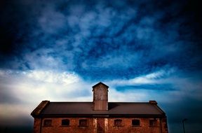 clouds over old building in the evening