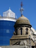 old tower on the background of a modern building in Buenos Ares