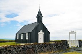 small icelandic church on the shore