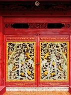 ornate door of old palace, thailand