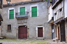 green shutters on a building in Spain