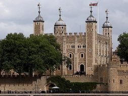 historical building with towers near the river thames