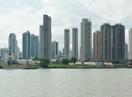 view of the skyscrapers of a modern city from the water