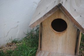 Decoration of wooden birdhouse in a garden