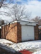 abandoned old garage at a snowy day