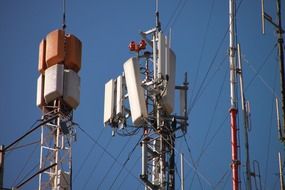 antennas and wires against the sky