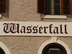 facade of the building with the inscription