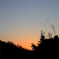 sunset afterglow in sky above house