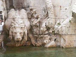 sculpture of a lion on a fountain in rome