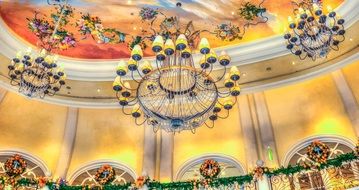 ceiling chandeliers over balconies