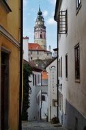 view of the castle through a narrow alley