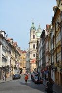 historic buildings on the street in Prague