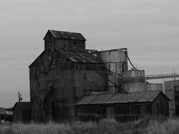 black and white photo of an old wooden factory