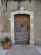 Facade of a building with a door in Provence, France