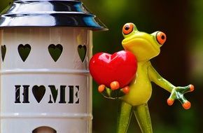 lovely house and toy frog with heart