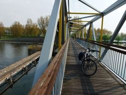 bicycle on wooden bridge at autumn, netherlands