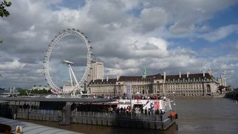 London ferris wheel view from the river Thames