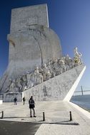 man stands near the monument in lisbon