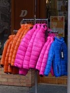 Colorful jacket clothes on the stand