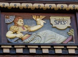 art of relief depicting a person with a dove, Hildesheim Germany, Lower Saxony