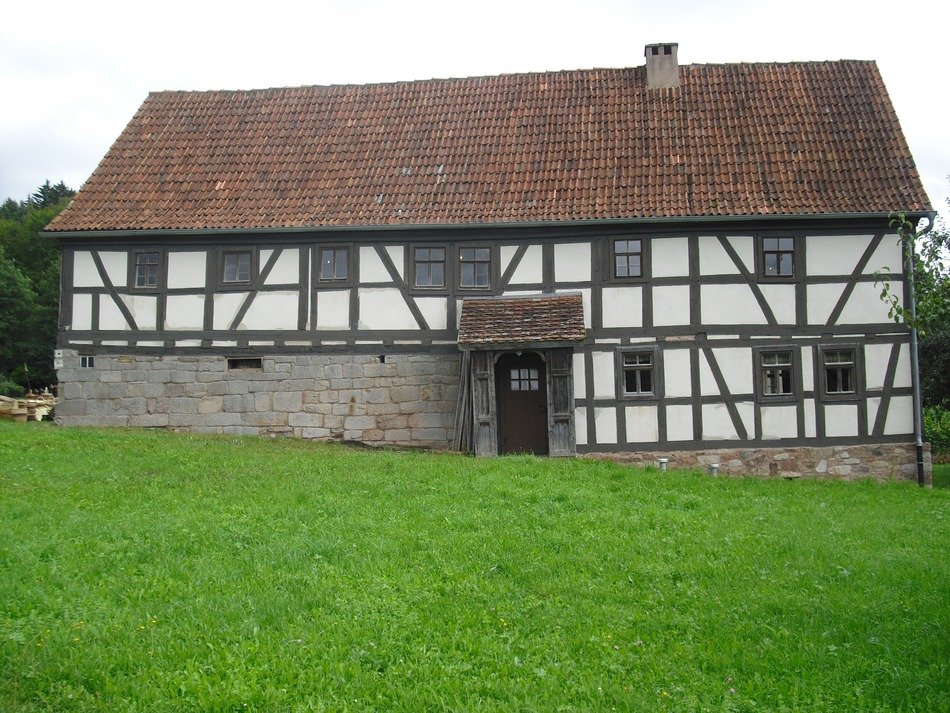 big country house among green grass