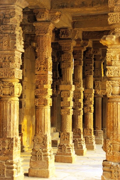 columns with drawings in a temple in india