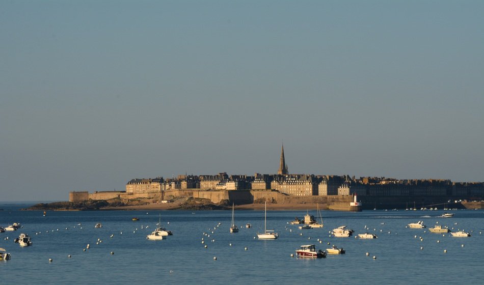 walled port in saint malo in the evening