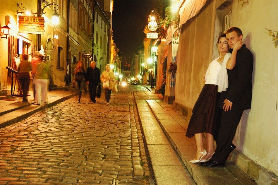 A pair of lovers of people on the street at night, Warsaw