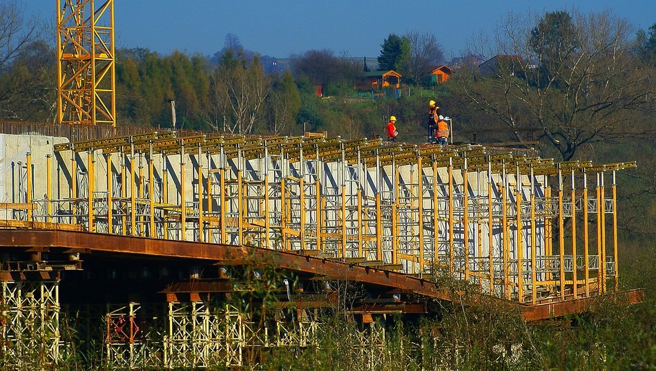 working people constructing steel frame