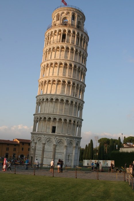 people looking at leaning tower in evening, italy, pisa