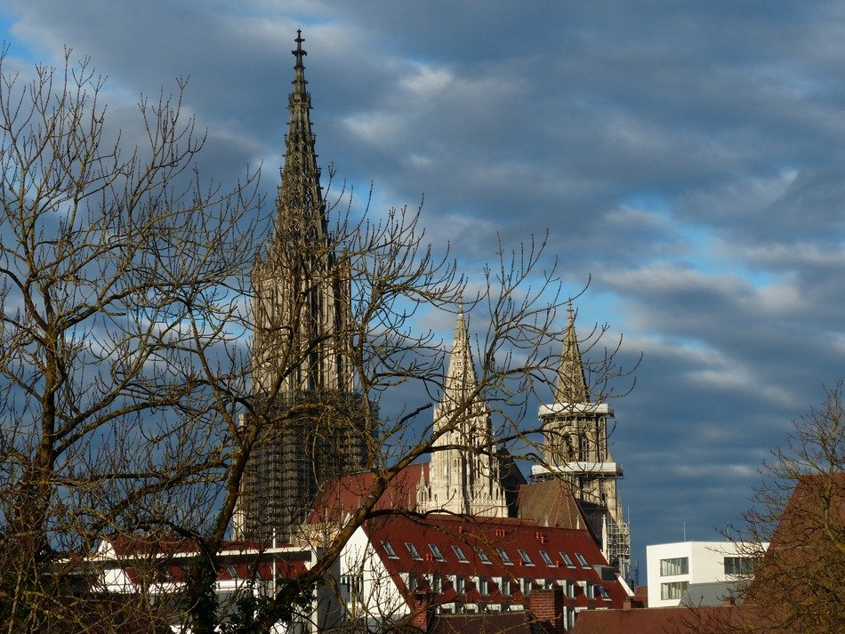 Spiers of the ulm of the cathedral in Munster on a background of a stormy sky