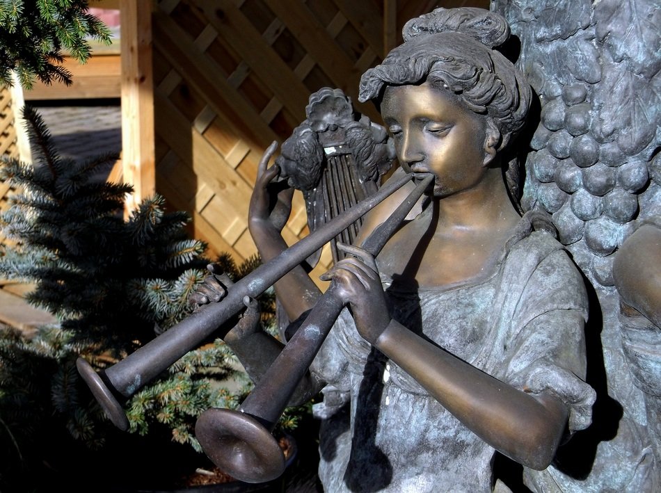 statue girl with music instrument